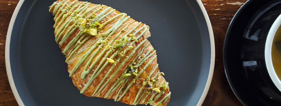 croissant drizzled with pistachio cream